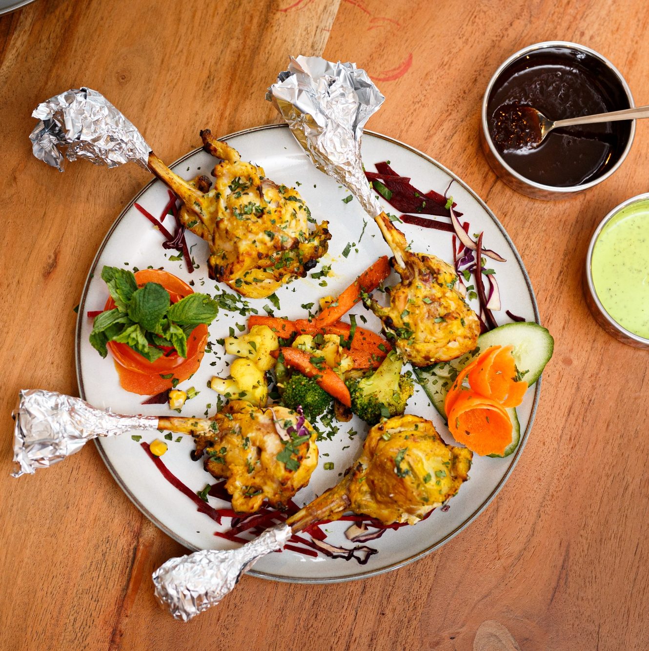 Chicken Lollipop and two types of sauces.