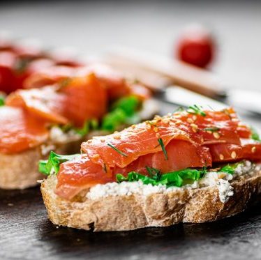 Sandwich with salmon and herbs.