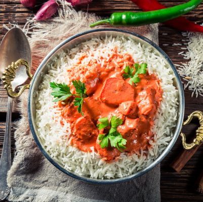 Spicy and sweet tikka masala with rice and sauce