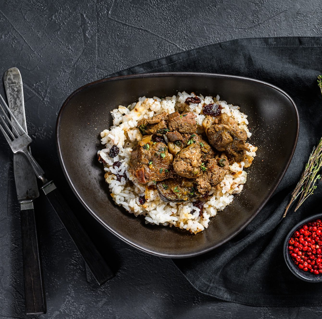 Traditional Indian curry lamb meat masala. Black background. Top view